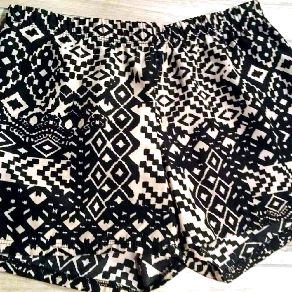 Black and Tan Shorts. Feels like silky "raincoat" material. I call them "whishy"